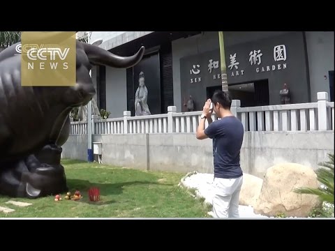Xiamen's answer to the Wall Street Bull? Residents pray for upturn in the market
