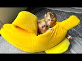Monkey Kaka hugs baby monkey Mit sleeping in a beautiful new bed