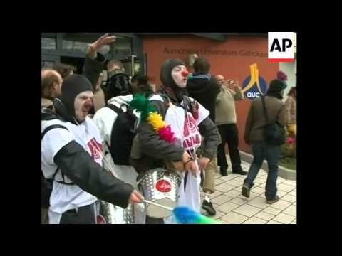 EDIT Air raid protest, rally against police action, flags burned; clown demo