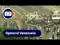 Legervoertuig rijdt over demonstranten heen bij opstand tegen Maduro