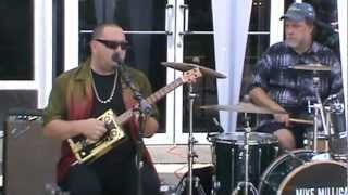 Mike Milligan and Steam Shovel performing with a 4 string Turkeychicken cigar box guitar
