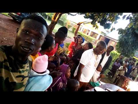 Eko Nash's father cutting the cake on his 50th surprise birthday party home celebrations