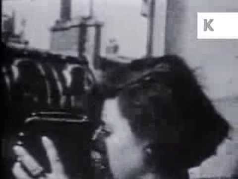 Woman films with 1920s Pathe Moto 9.5mm Camera