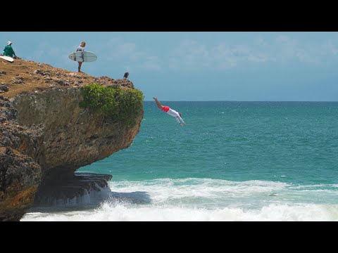 SURFING WITH A JUMP FROM THE CLIFF AT HONEYMOON CLIFF SURF POINT