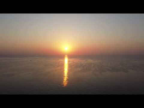 Flying over the Mediterranean Sea at dawn