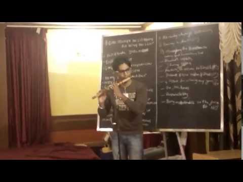 Naveen playing flute on Landmark celebration day!!