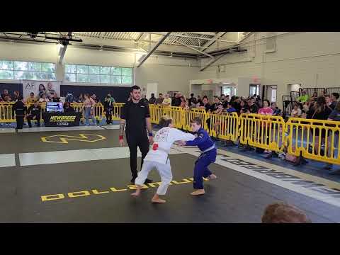 White Belt Youth Match At BJJ Competition With Triangle Choke Position Leading To Armbar