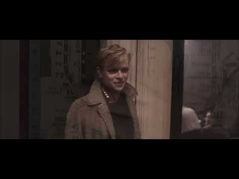 Closing trailer shot: a riverbank and city lights as a modern song bleeds into strings