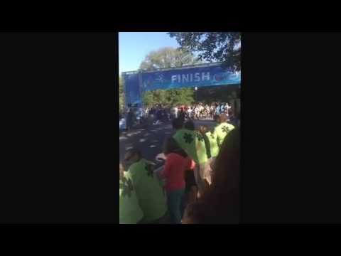 Isiah Koech crossing the finish line in the 10k at the 2014 Crescent City Classic
