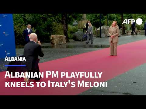 Albanian PM Rama kneels playfully to greet Italy's Giorgia Meloni | AFP