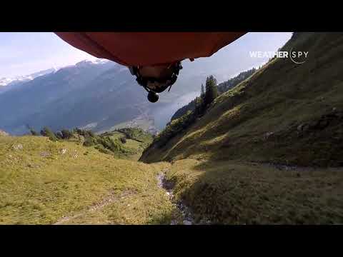 Wingsuit Guy Flights Through Mountain Ridge