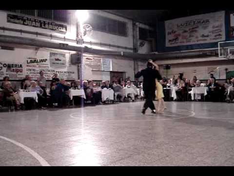  Nancy Louzan  and  Damian Ignacio Eselevsky Esell  are  dancing  to  the  vals  "  Pabellon De Las Rosas  "