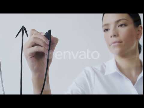 Female Entrepreneur Presenting Plan on Glass Wall | Stock Footage - Envato elements