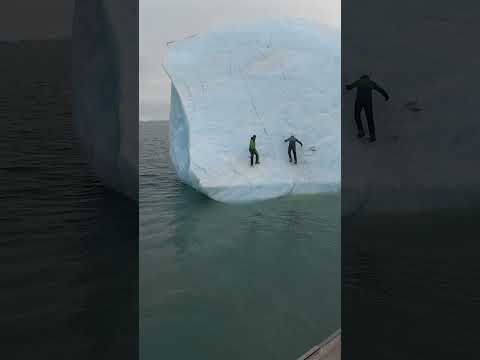 This huge iceberg flipped on these two guys! 😮🤯  -  🎥 Viralhog