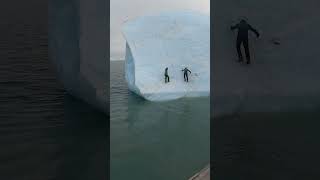 This huge iceberg flipped on these two guys! 😮🤯  -  🎥 Viralhog