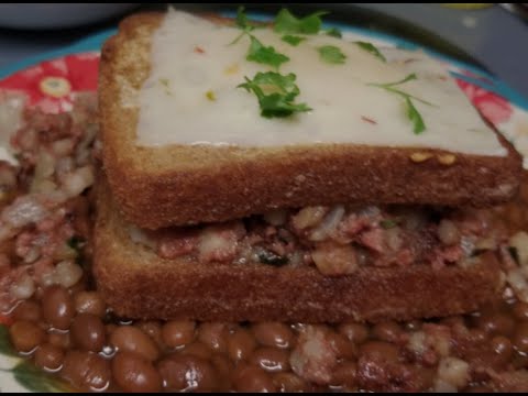 Mary's Corn beef hash in a Nest over baked beans..