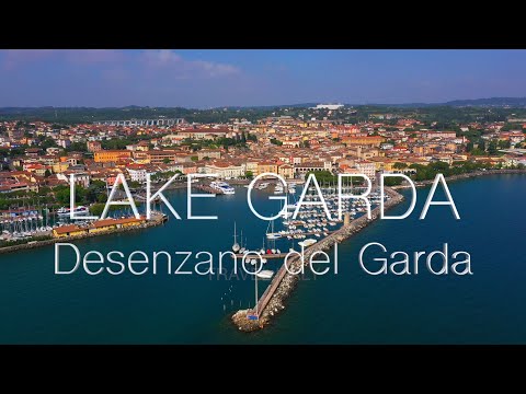 Desenzano del Garda City Tourist Place on Lake Garda, Italy. Aerial drone 4K video. Relaxing Music