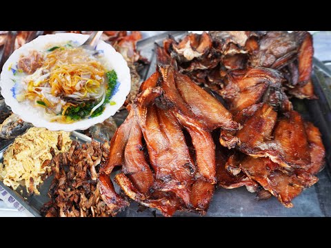 Street food breakfast, eating pork rice porridge and fried noodles, Cambodian street food