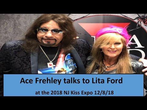 Ace Frehley talking with Lita Ford at her table at the 2018 NJ Kiss Expo on 12/8/18