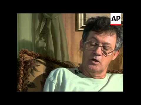 Amputee tests 'bionic' thought-controlled artificial arm