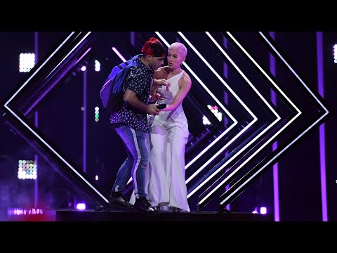 Moment stage invader grabs mic during UK Eurovision song