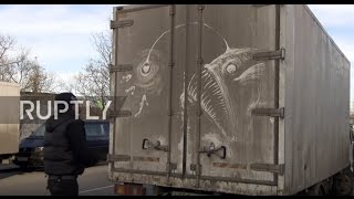 Russia: Filthy minded! Street artist draws masterpieces onto DIRTY trucks