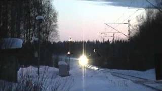 Express train 707 passes Suontee level crossing and old Suontee halt platform