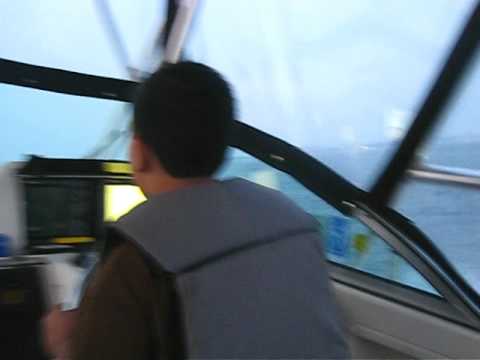 A Kid Driving a Boat in the Atlantic Ocean