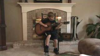 9 year old Alex Riess plays guitar