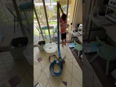 Kid playing with Blu Track and marbles