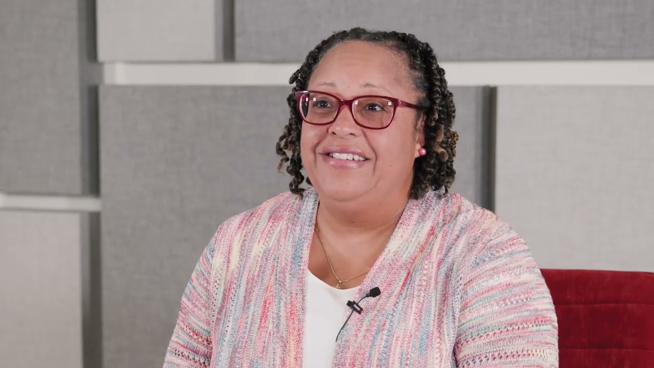 Katheldra Alexander seated giving an interview