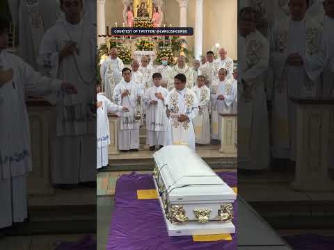 Father Picx Picardal blessed by fellow priests before burial