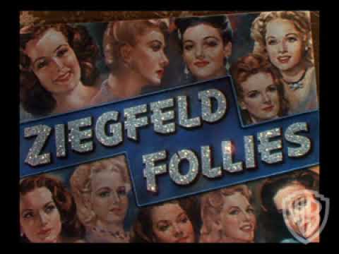Trailer frame with neon title card and chorus silhouettes