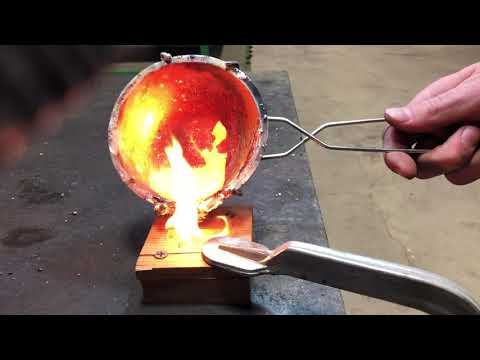 Hand Pouring a Bronze Cross