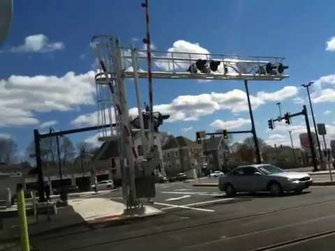 Two Trains at Cabot Street Railroad Crossing