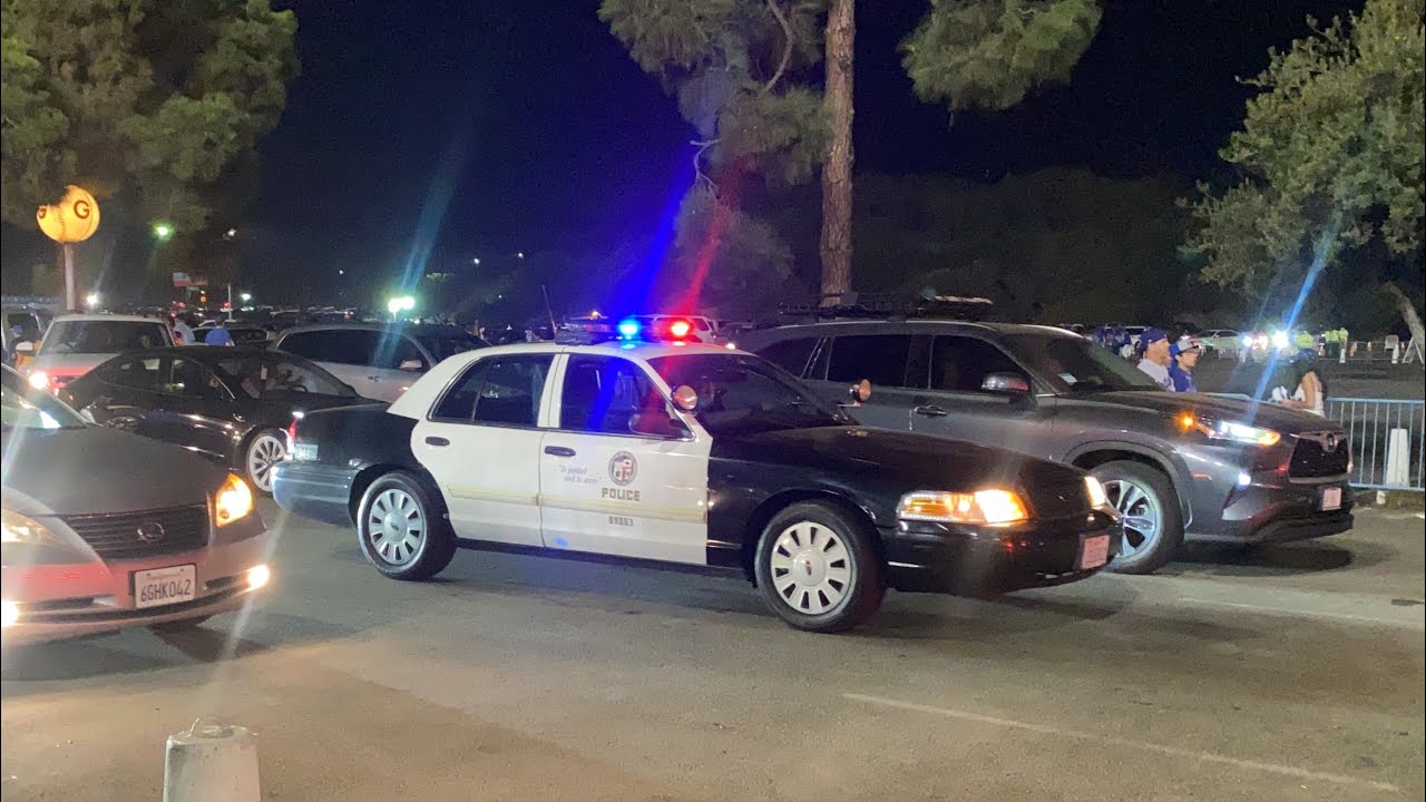 LAPD FORD CROWN VICTORIA POLICE INTERCEPTOR ON PATROL DURING A DODGERS GAME LIGHTS ON