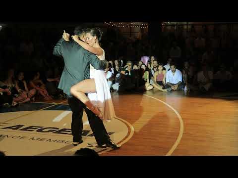  Juana Sepulveda  and  Mariano Frumboli  are  dancing  to  a  tango  at  A los amigos tango festival  in  2019