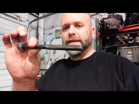 Super important step - cleaning the engine head bolt holes using a old bolt