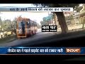 Caught On Camera: Man clings to the front window of the bus in Allahabad