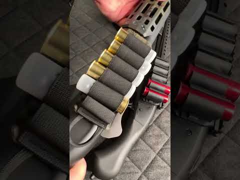 lay the shotgun on its side with the ejection port facing up