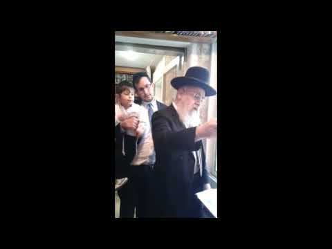 Rav Yitzchak Yosef Lighting Menorah