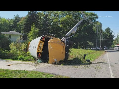 Bus rolls over after crash with car