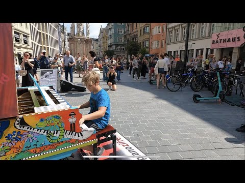 How to attract a crowd in 8 Minutes? Street Piano Performance by 11 year old boy