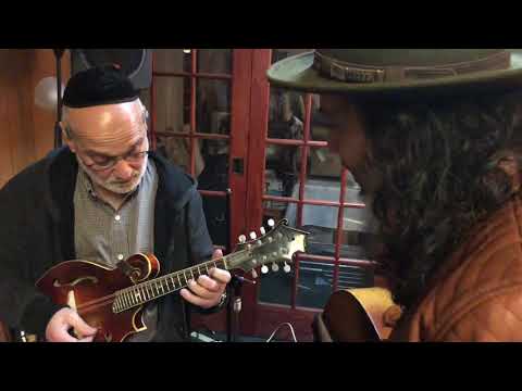 Andy Statman taking a look at my mandolin