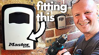 My Dad's gonna get robbed!  (putting up a Master Lock combination key safe...)