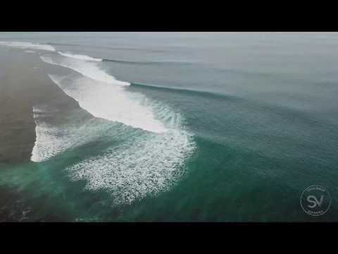 Scenic aerial views and drone shots of surfers at Ujung Bocur