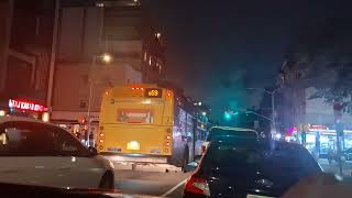 Mta bus Williamsburg Bridge Plaza and Rego Park bound Q59 buses + NIS bus at Grand Avenue at night