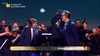 Tom Fletcher and his son Buzz performing Thread of Hope on BBC Children in Need 2025