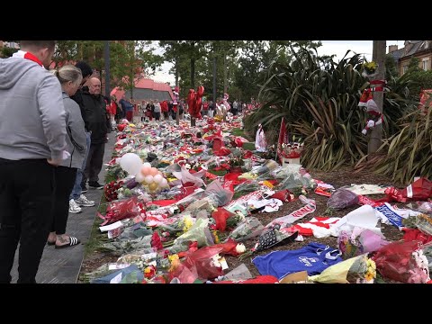 People lay flowers for Diogo Jota outside Liverpool's Anfield stadium | AFP