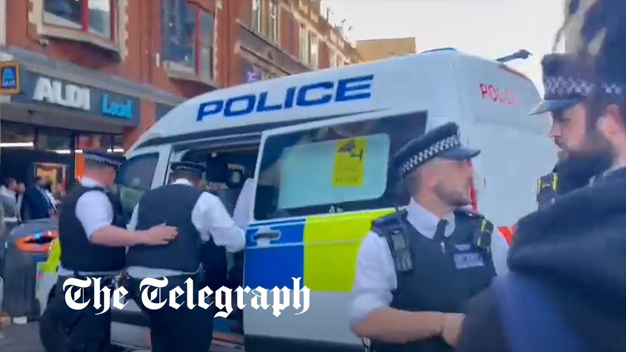 Watch: Policeman repeatedly punches protester in the head - Vimarsana News